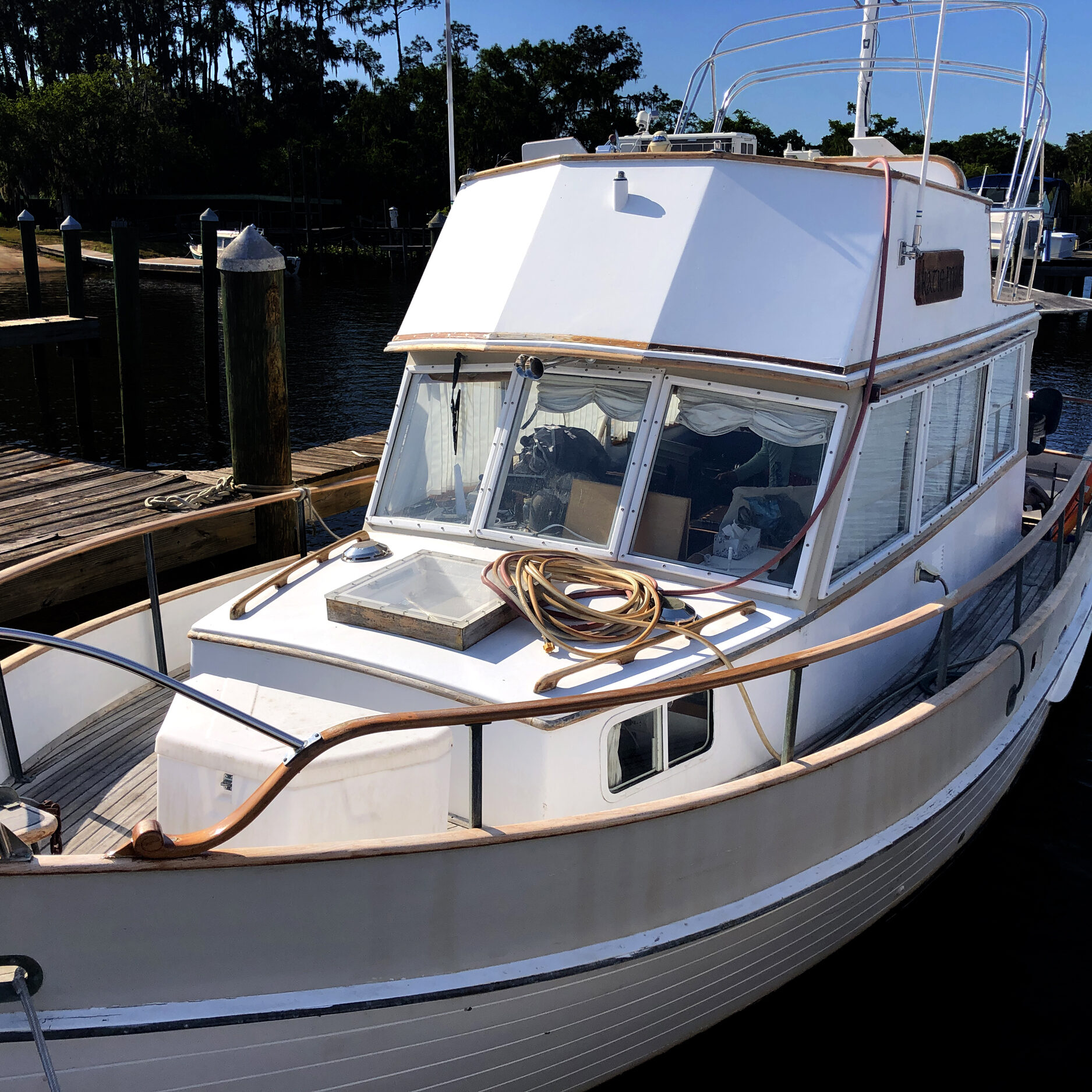 wood boat in water prior to accredited marine surveyor exam